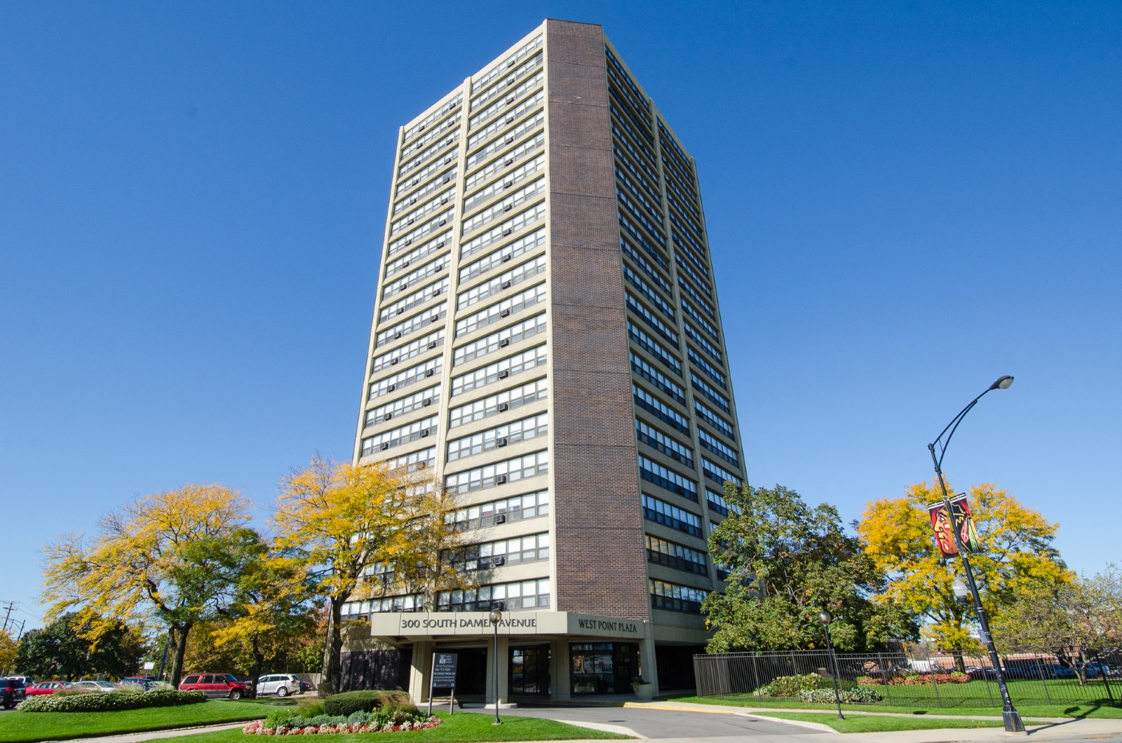 a tall building with a blue sky in the background